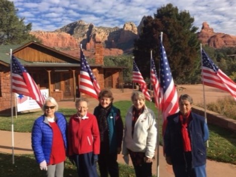 This photo shows five members of the Oak Creek Chapter, NSDAR, posing with U.S. flags they set out to honor Veterans Day.